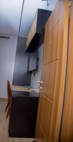 a wooden door in a kitchen with a counter at Saphir Boutique Hotel in Kigali