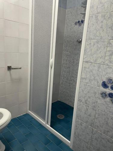 a shower with a glass door in a bathroom at Villa del Monte di Cocco in Massarosa