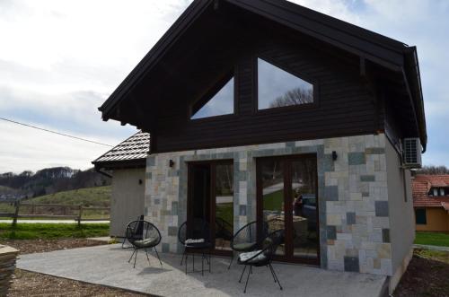 a group of chairs sitting outside of a building at Montana Goc in Goč
