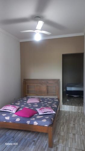 a bedroom with a bed and a ceiling at Cantinho Caiçara in São Sebastião