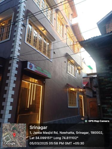 a building with a sign on the side of it at Winter Wonder in Srinagar
