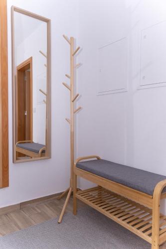a room with a bed and a mirror at Casa Alagoa in Montemor-o-Velho