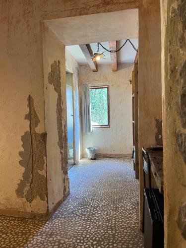 an unfinished room with a bathroom with a toilet at Boutique Hostal La Curandera de Salinas in Ibiza Town