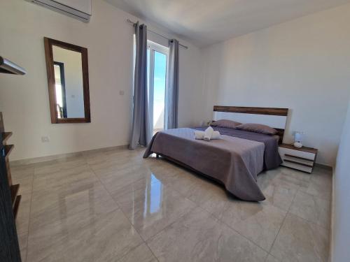 Postel nebo postele na pokoji v ubytování Chaltan Apartment - Raħal Ġdid