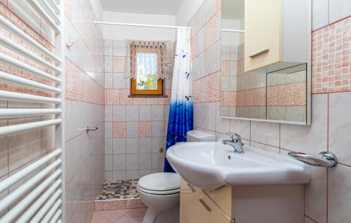 a bathroom with a sink and a toilet at Villa with pool Riviera in Crikvenica