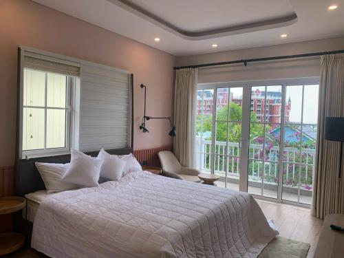 Postel nebo postele na pokoji v ubytování DREAM HOUSE 2 NovaWorld Phan Thiết