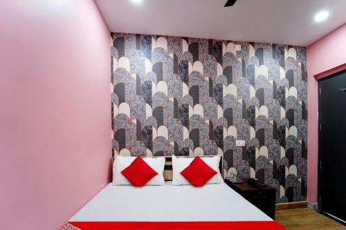 Postel nebo postele na pokoji v ubytování Hotel O Jai Jagannath Inn