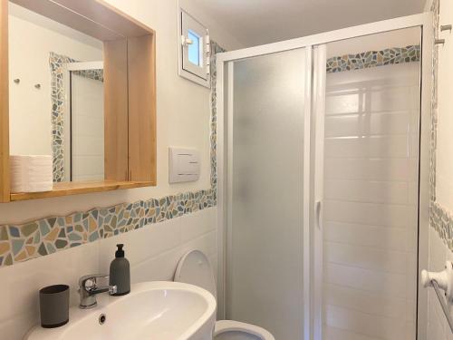 a bathroom with a sink and a shower at Rosa Dei Venti Marettimo in Marettimo