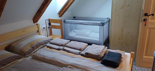 a bedroom with a bed with a fish tank at HIŠA Margit in Rateče