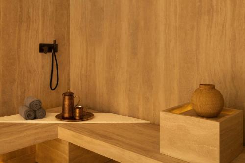 a bathroom with a shower and a vase on a shelf at Bab Samhan, a Luxury Collection Hotel, Diriyah in Riyadh