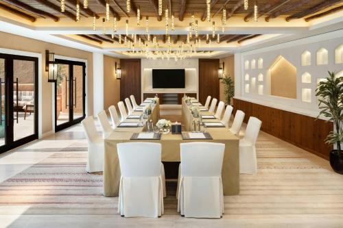 a large conference room with a long table and white chairs at Bab Samhan, a Luxury Collection Hotel, Diriyah in Riyadh