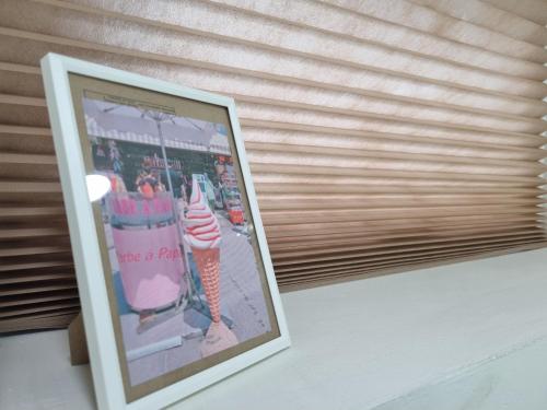 a picture of a framed picture of an ice cream shop at Shin-Nonhyeon Hideout in Seoul