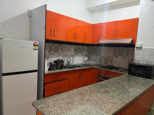Η κουζίνα ή μικρή κουζίνα στο Seaview Heights Apartment