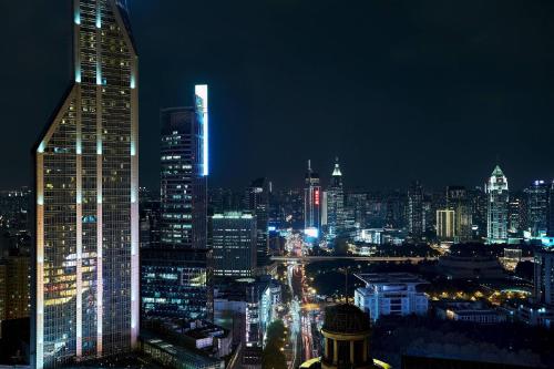 a view of a city at night with at Shanghai Marriott Marquis City Centre in Shanghai