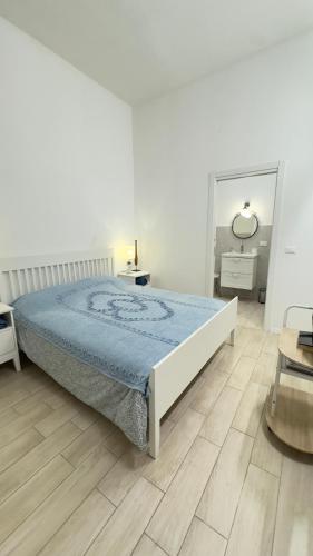 Una cama o camas en una habitación de Cinque Lampadi Acquario