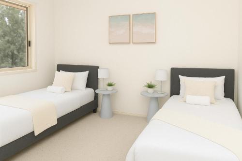 Ένα ή περισσότερα κρεβάτια σε δωμάτιο στο Sea Breeze Getaway, secluded family home filled with relaxation