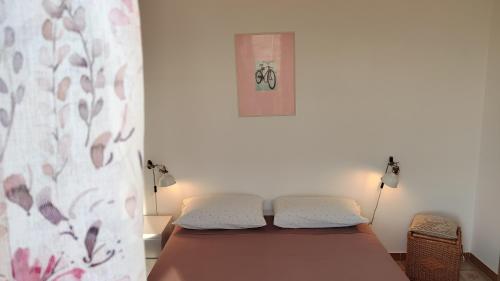 a bedroom with a bed in a room at Eco House San Michele in San Michele