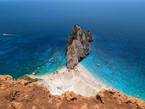 an aerial view of a rock formation in the ocean at Daniela Village House in Keri