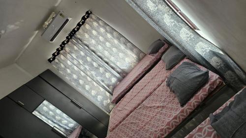 an overhead view of a bed in a room at Royal AC & Non AC Dormitories in Trichūr