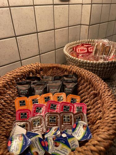 a basket full of toothbrushes in a bathroom at Casa al Cuore Lefkas in Lefkada Town
