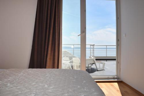 Posteľ alebo postele v izbe v ubytovaní Apartments King