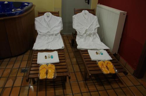 two chairs with white towels and shoes on them at Villa Platythea in Platy