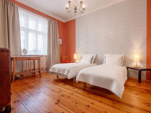 a bedroom with two beds and a window at Apartment Chopina by Interhome in Sopot