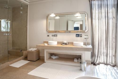 a bathroom with a sink and a mirror at Palais Namaskar in Marrakech
