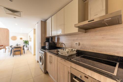 a kitchen with a sink and a stove at El Gouna - BIRD NEST in Hurghada