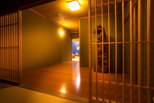 a room with a cage with a person in it at Yuyaruru Saisai in Kanazawa