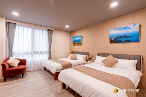 Ένα ή περισσότερα κρεβάτια σε δωμάτιο στο 候鳥宜居 宜蘭包棟民宿