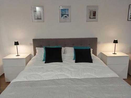 Ένα ή περισσότερα κρεβάτια σε δωμάτιο στο SUITE CONTI 36 terrazza sul mare