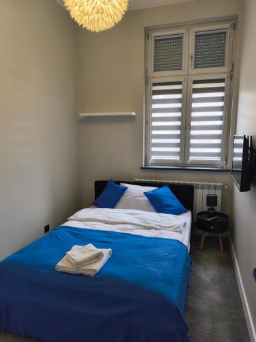 Postel nebo postele na pokoji v ubytování Tabago Studio 32 Brzeg Wolności
