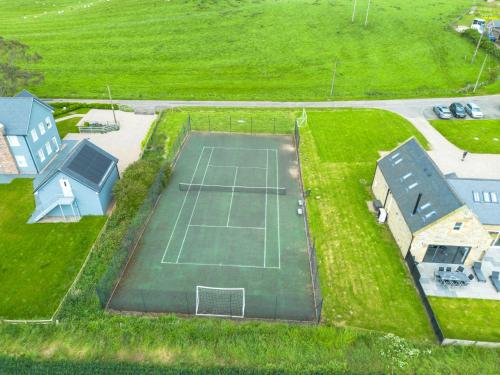 an overhead view of a tennis court with a tennis at St Aidans Cottage - North East Escapes in Bamburgh