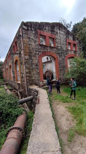 a group of people standing in front of a building at La ermita del bosque in Valparaíso