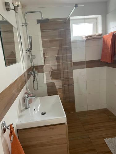 a bathroom with a sink and a shower at 3 izbovy RD - bungalow in Bernolákovo