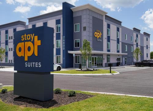 a building with a sign that says stay off suites at stayAPT Suites Madison-Greenbrier in Madison