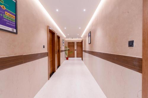 an empty corridor in a building with a long hallway at Treebo SV Residency, Vellore in Vellore