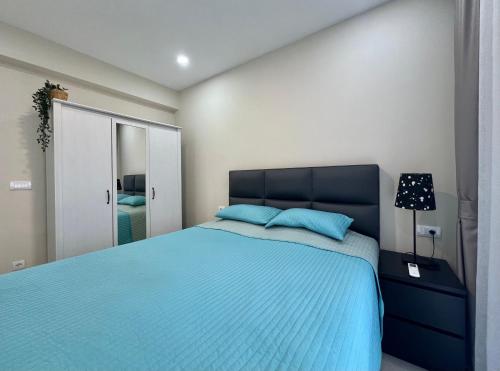 Llit o llits en una habitació de Danver Apartment
