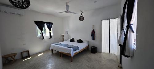 Postel nebo postele na pokoji v ubytování Casa Universo Holbox