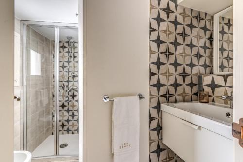 a bathroom with a white tub and a shower at B&B Fiore in Gallipoli