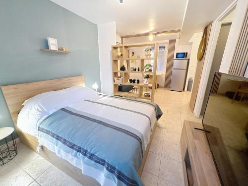 En eller flere senge i et værelse på Studio accueillant et calme centre ville Tarbes