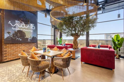 a restaurant with chairs and a table in a room at Citymax Hotel Business Bay in Dubai