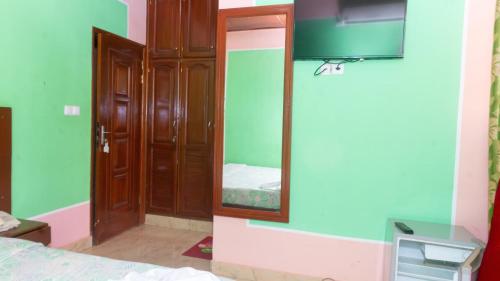Ein Bett oder Betten in einem Zimmer der Unterkunft Hotel Residence Madadjeu