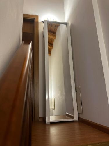 a mirror sitting on the side of a room at Ca' Teresa in Ravosa