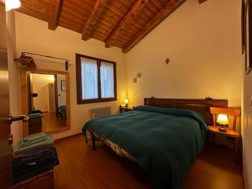 a bedroom with a bed and a mirror in it at Ca' Teresa in Ravosa