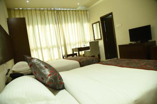Postel nebo postele na pokoji v ubytování Viz Park Hotel