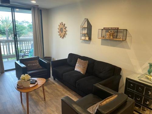 a living room with a couch and a table at NEW NEW Gorgeous Condo on the beach in Oceanside