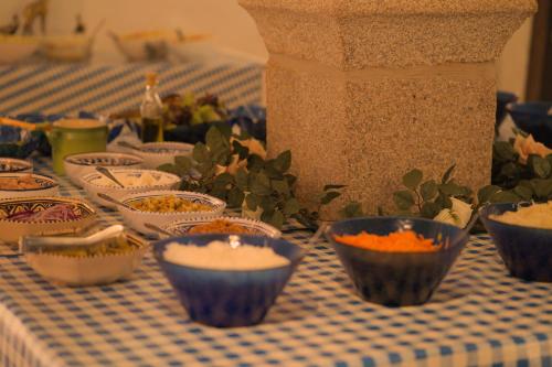 a table topped with bowls of food on a table at Gasthof goldener Engel in Kemnath