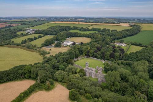 an aerial view of an old castle in a field at Best Western Lamphey Court Hotel and Spa in Lamphey